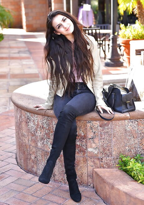 Excellent brunette babe Natalie baring small tits and spreading her legs outside