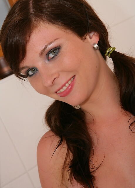 Shapely brunette young Jenny revealing small tits and pussy in shower